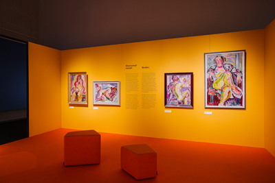 Yrjö Saarinen painting's Yrjö Saarinen painting's hanging on the orange wall.