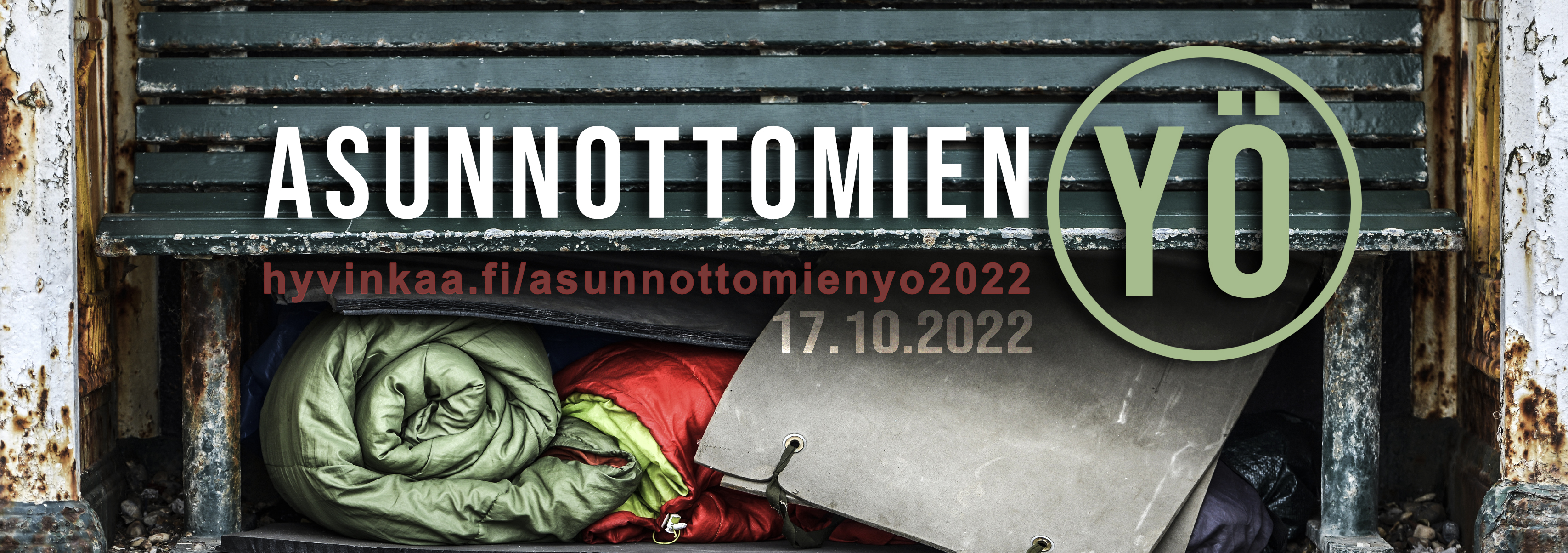 Kuvassa penkki jonka alla makuupussi, muovipussi ja jumppapatja. Otsikkona Asunnottomien Yö, sekä hyvinkaa.fi/asunnottomienyö2022 verkkosivuosoite